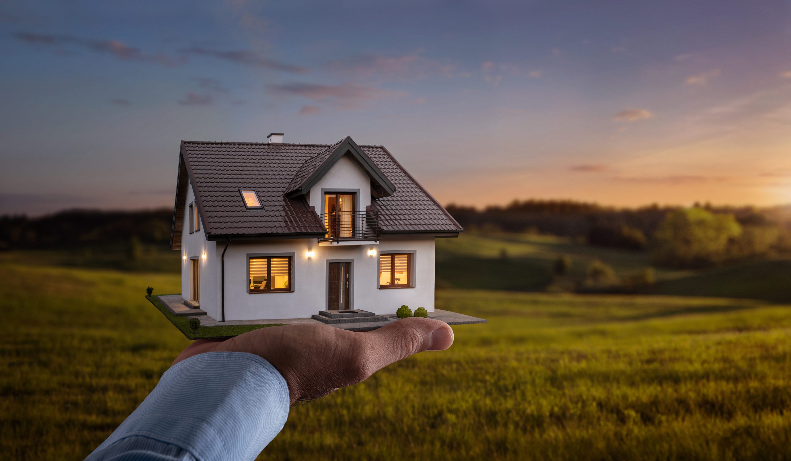 Concept of buying or building new home. Male hand showing, offer This is a picture for a blog about choosing the right insulation installers.